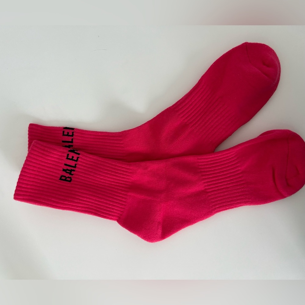 Pink socks that say #balenciaga”